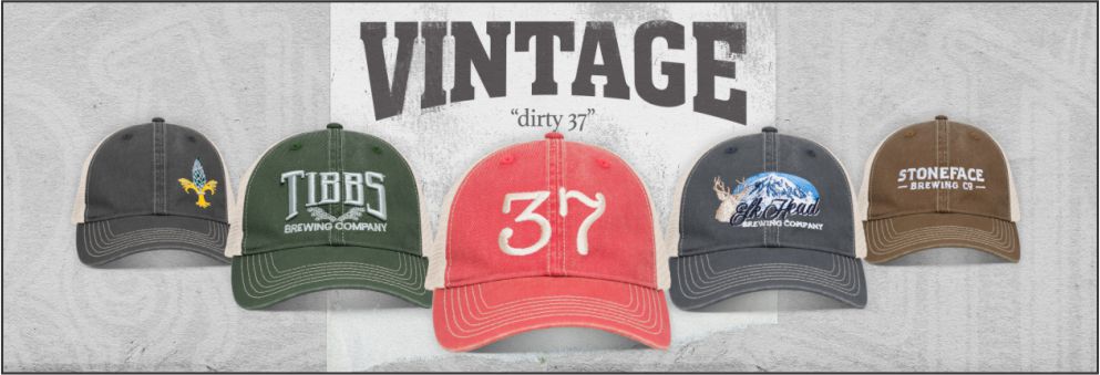 New Style: V37 “Dirty” Vintage Trucker Cap – The Dirty37 The V37 is an unstructured, double washed cotton cap with soft poly trucker mesh and snapback closure. V37 is intended to fit into multiple markets. The style of this cap is popular at the retail level, especially as an alternative “fan gear” item in team stores, bookstores, as well as a swag piece at restaurants, bars, concert venues, etc. With its double washed “dirty” look and soft tan mesh, it has a collegiate vibe that has appeal to both men and women – along with that All-American, hard-working, Joe Six-Pack feel that many want to achieve. Key features: - Double Washed Cotton for “Dirty” or “Worn”  Look - Extra Soft Tan Trucker Mesh - Matching Color Snapback Closure - Old School Green Undervisor - Casual Unstructured Low Profile.